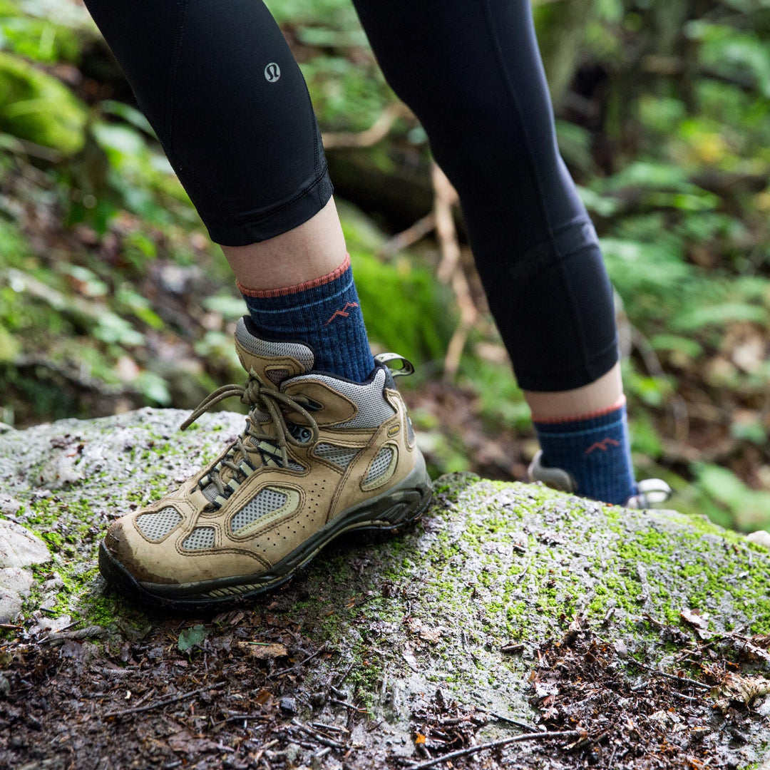 Woman wearing darn tough hiking socks made with merino wool, not cotton