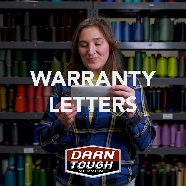Warranty letters - Emily holding up a warranty letter to read