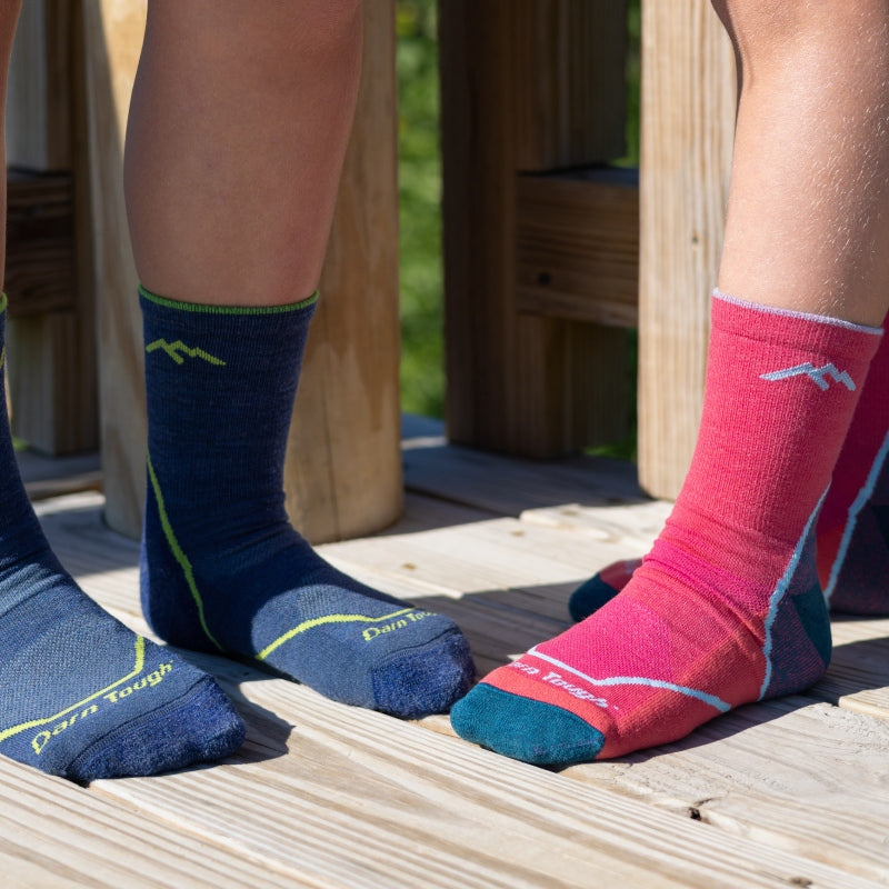 2 pairs of small feet in the kid's Micro Crew Hiking Socks