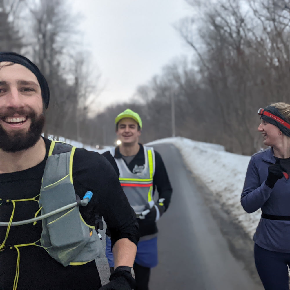Owen and two friends running down a road as part of 100 mile race training