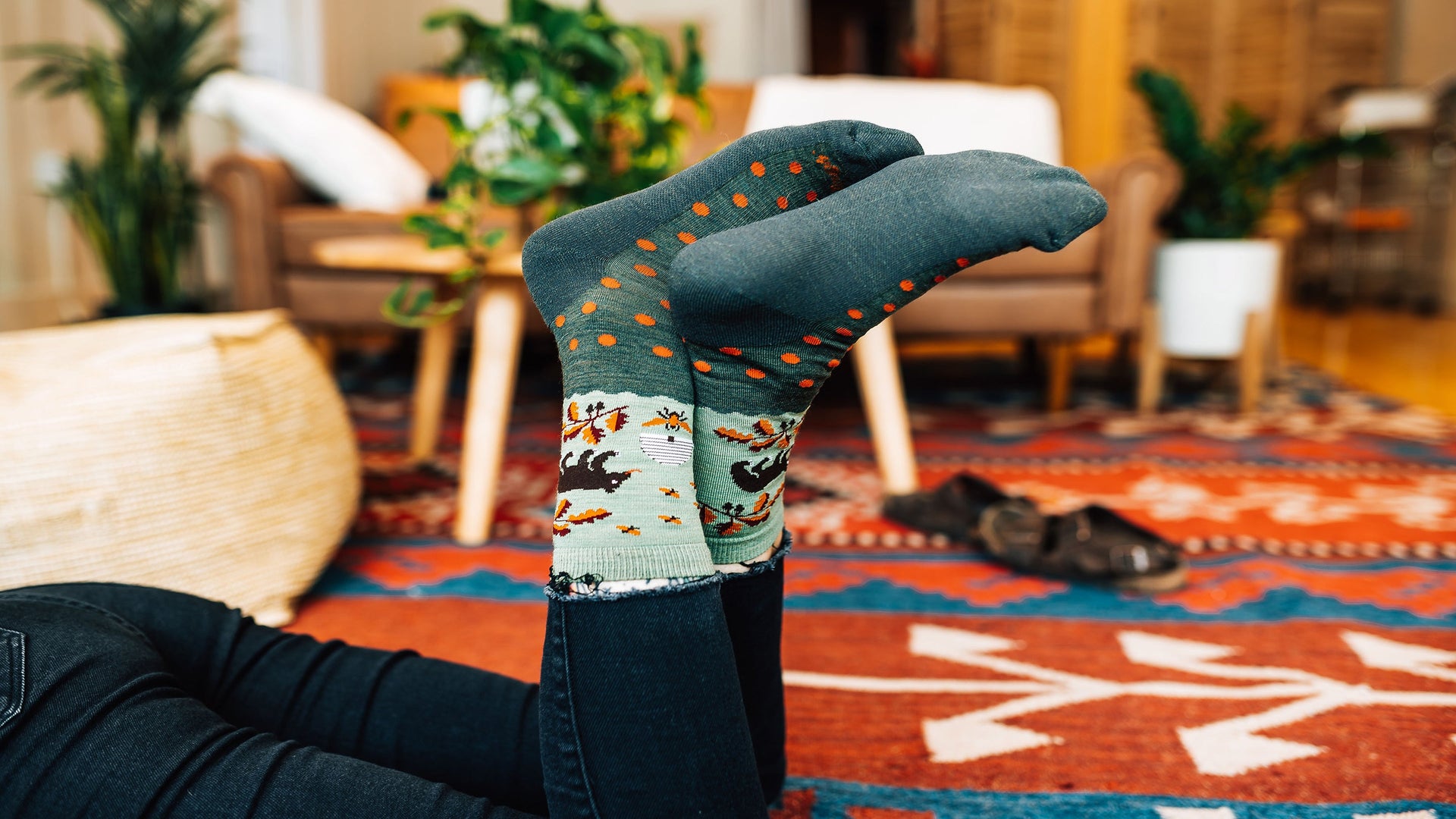 Model feet in the air wearing the wildlife  crew in forest 
