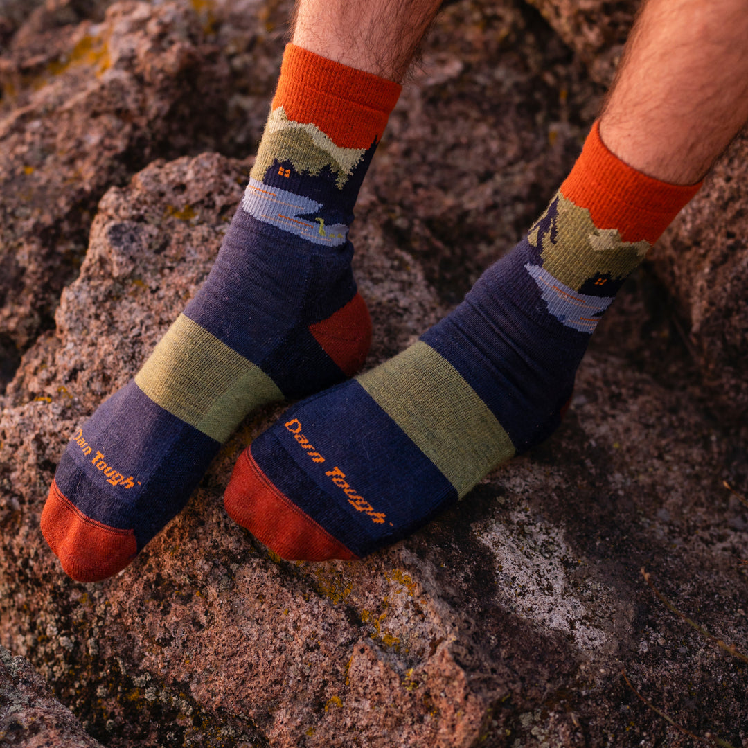 Close up on model wearing the 5014 Close Encounters in Eclipse while rest feet on rock