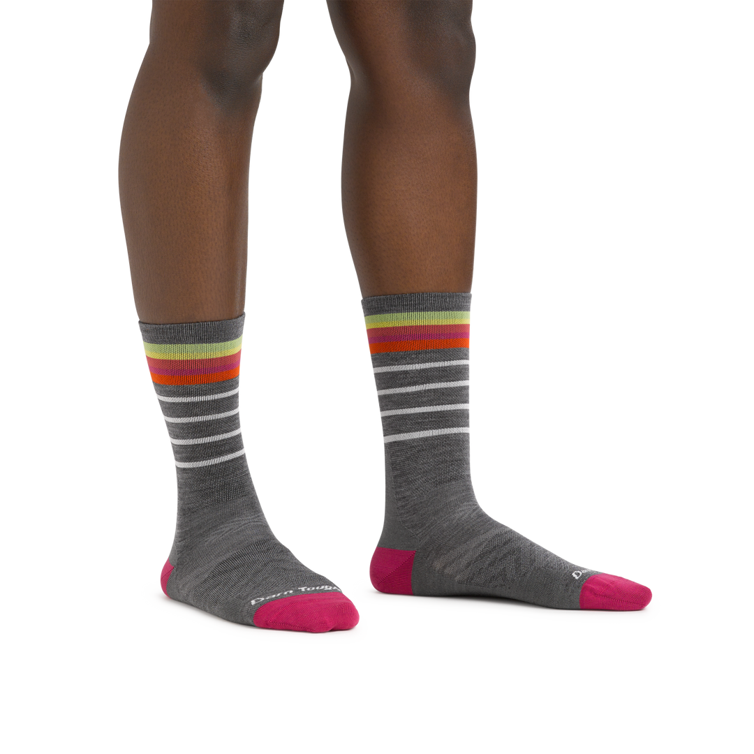 Image of a woman's legs on a white background wearing Women's Stride Micro Crew Ultra-Lightweight Running Sock in Gray