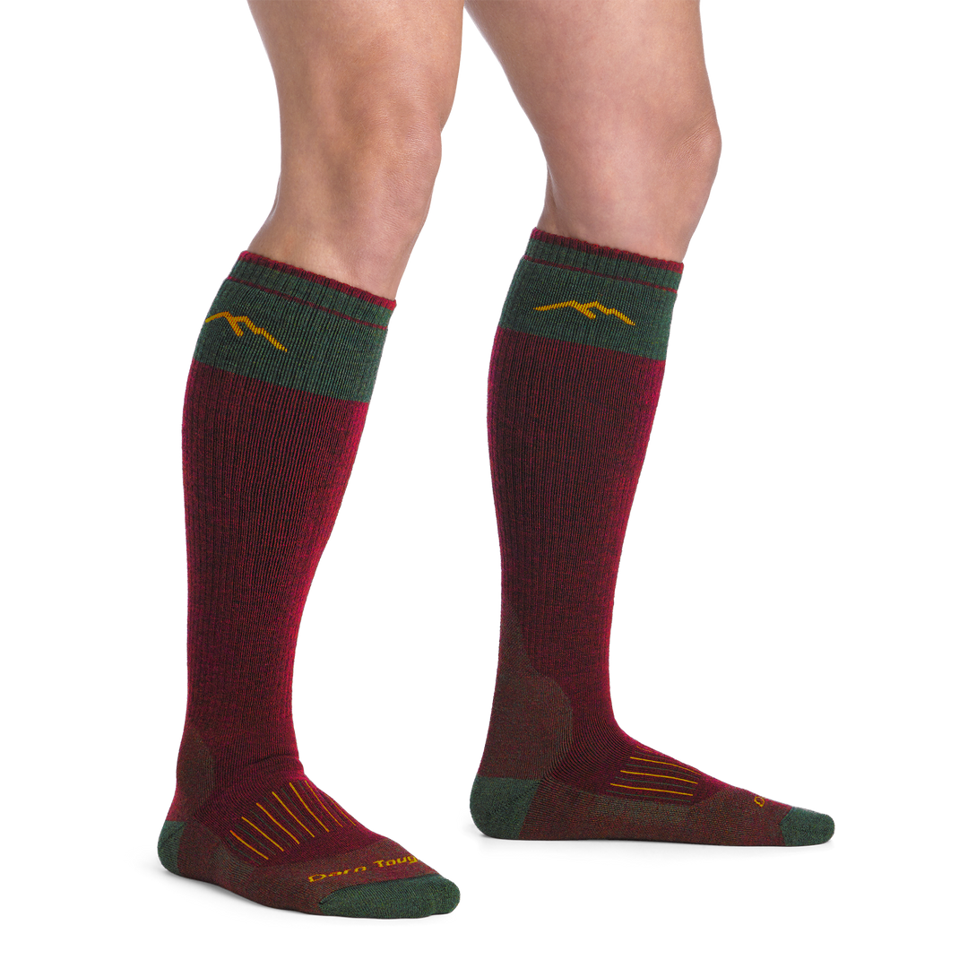 on model image bare foot wearing the 2105 hunting over the calf sock in ember colorway