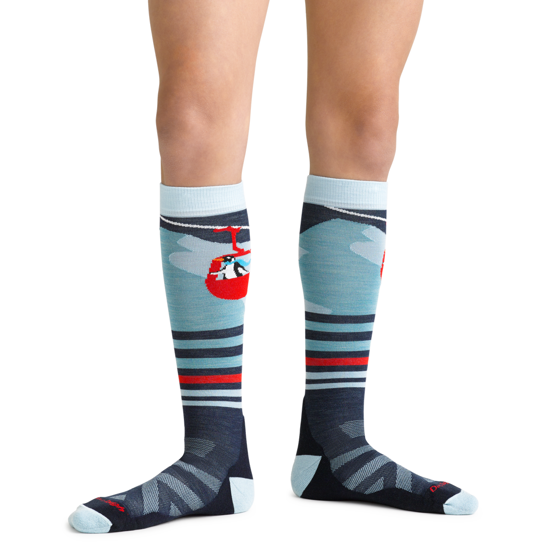 Skipper Kids' Snowboard and Ski Sock in Glacier Blue on foot showing penguin