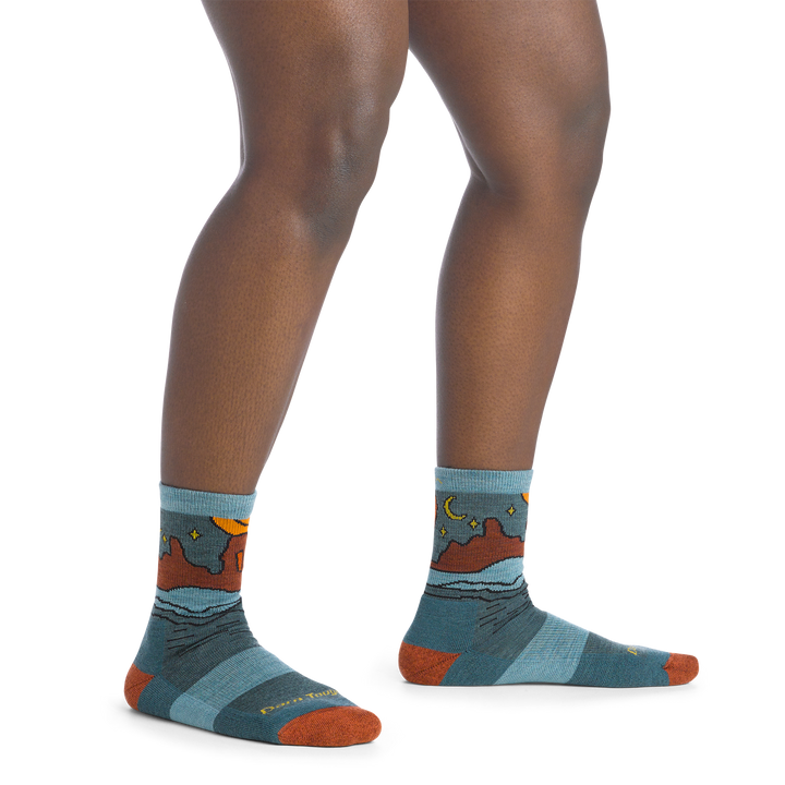 on model image bare foot wearing the 5023 celeste micro crew sock in teal colorway