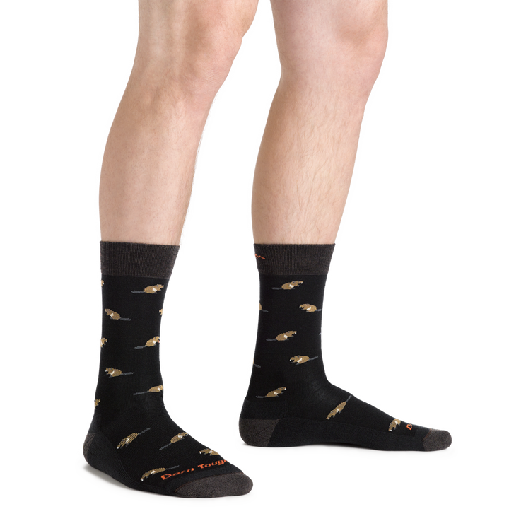 Side studio shot of model wearing men's sawtooth crew lifestyle sock in black