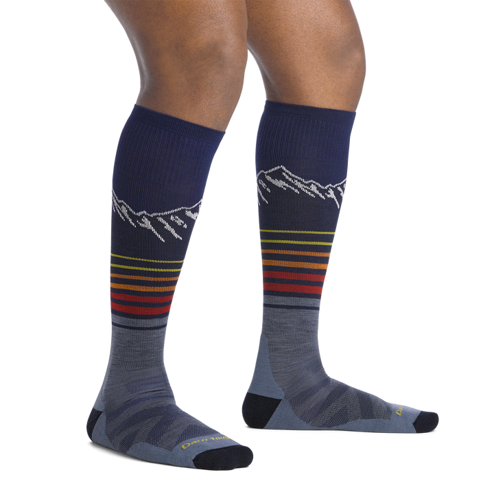 on model image bare foot wearing the 8052 steep lines over the calf sock in eclipse colorway