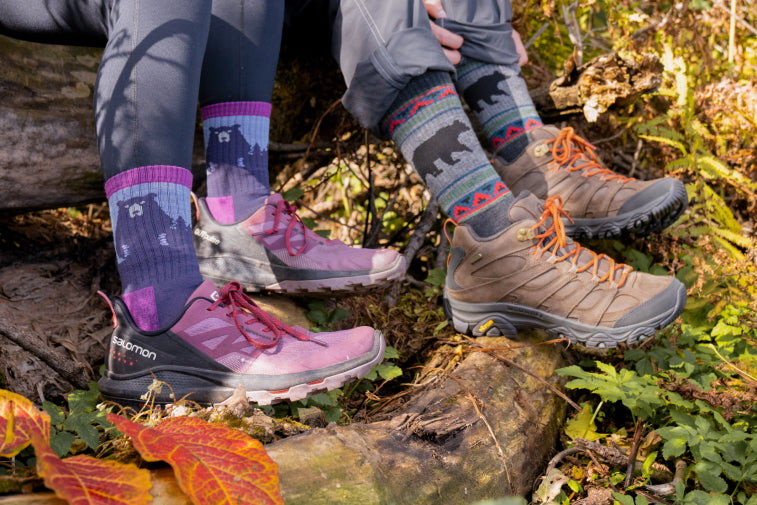Shop Sock Multi-Packs - two pairs of feet wearing coordinated socks with bear patterns