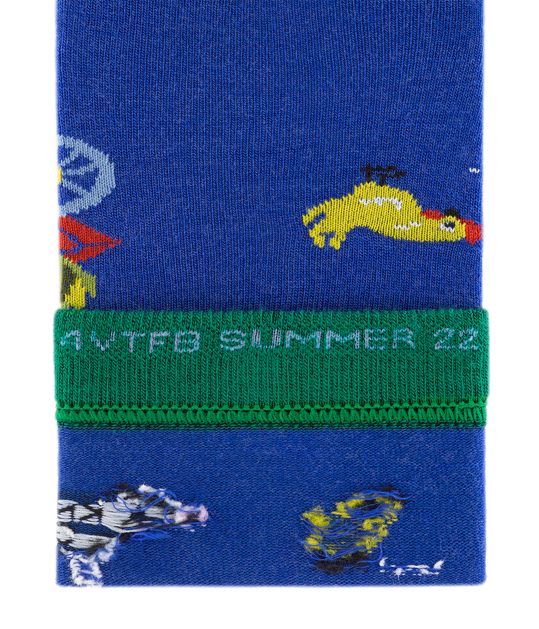 Close up of barnyard crew sock trim with 'For VT Food Bank Summer 22' stiched on the inside